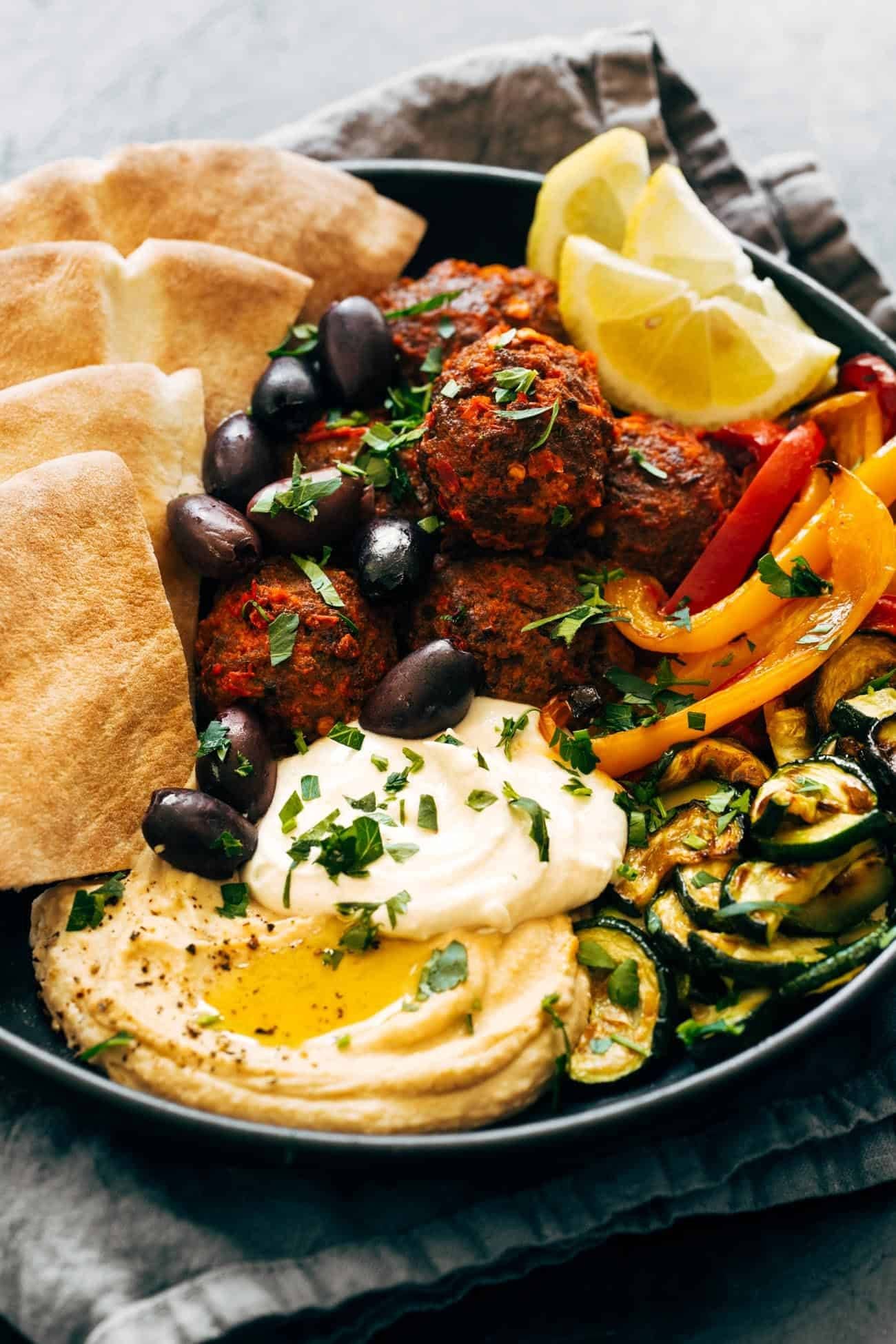 Harissa meatballs with hummus and whipped feta.