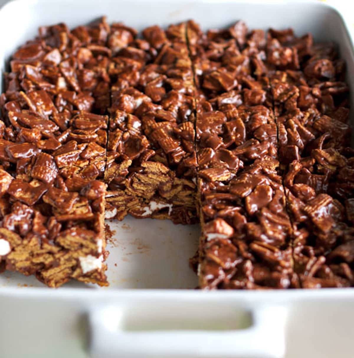 Golden Grahams s'mores bars in a white dish.