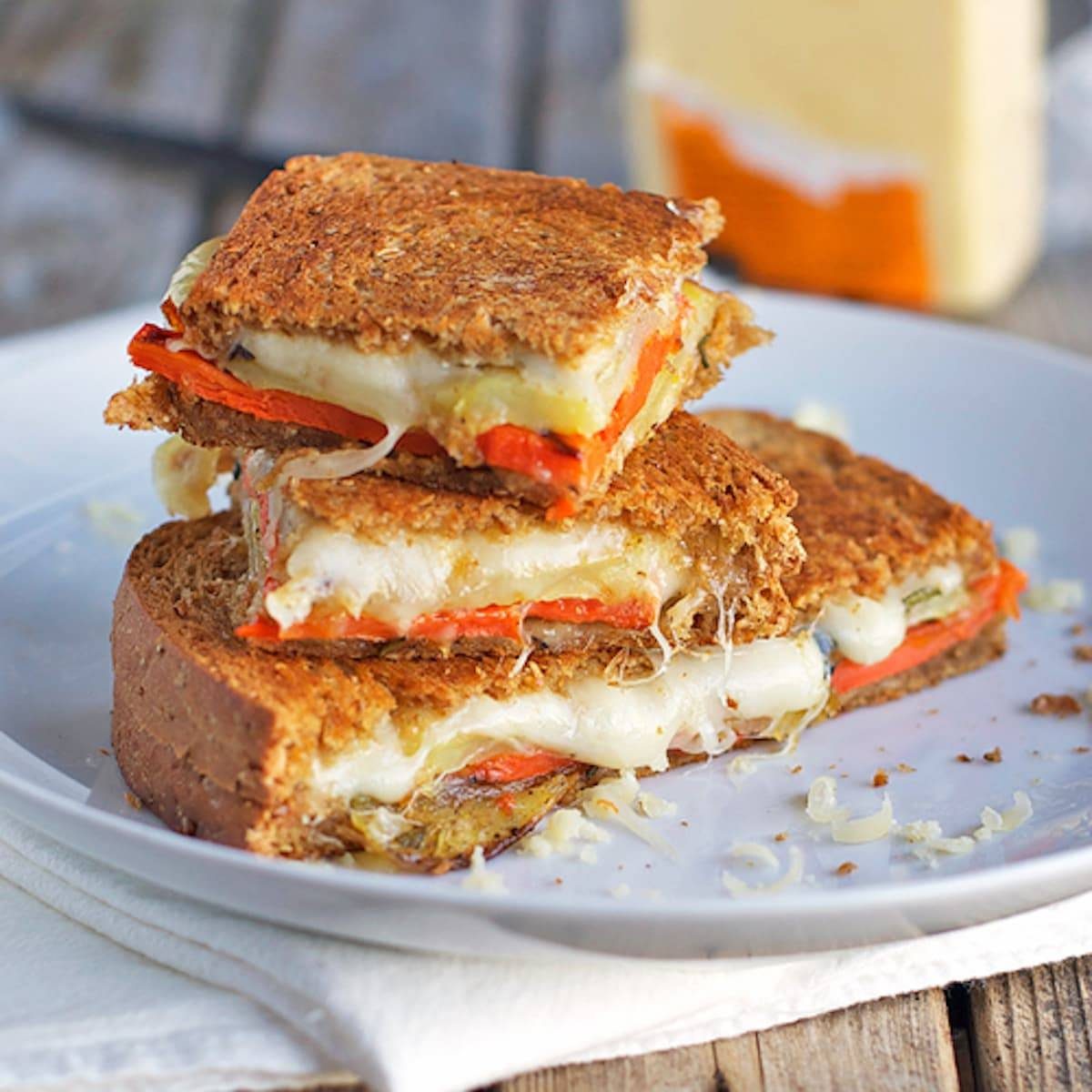 Three cheese grilled cheese sliced into several pieces.